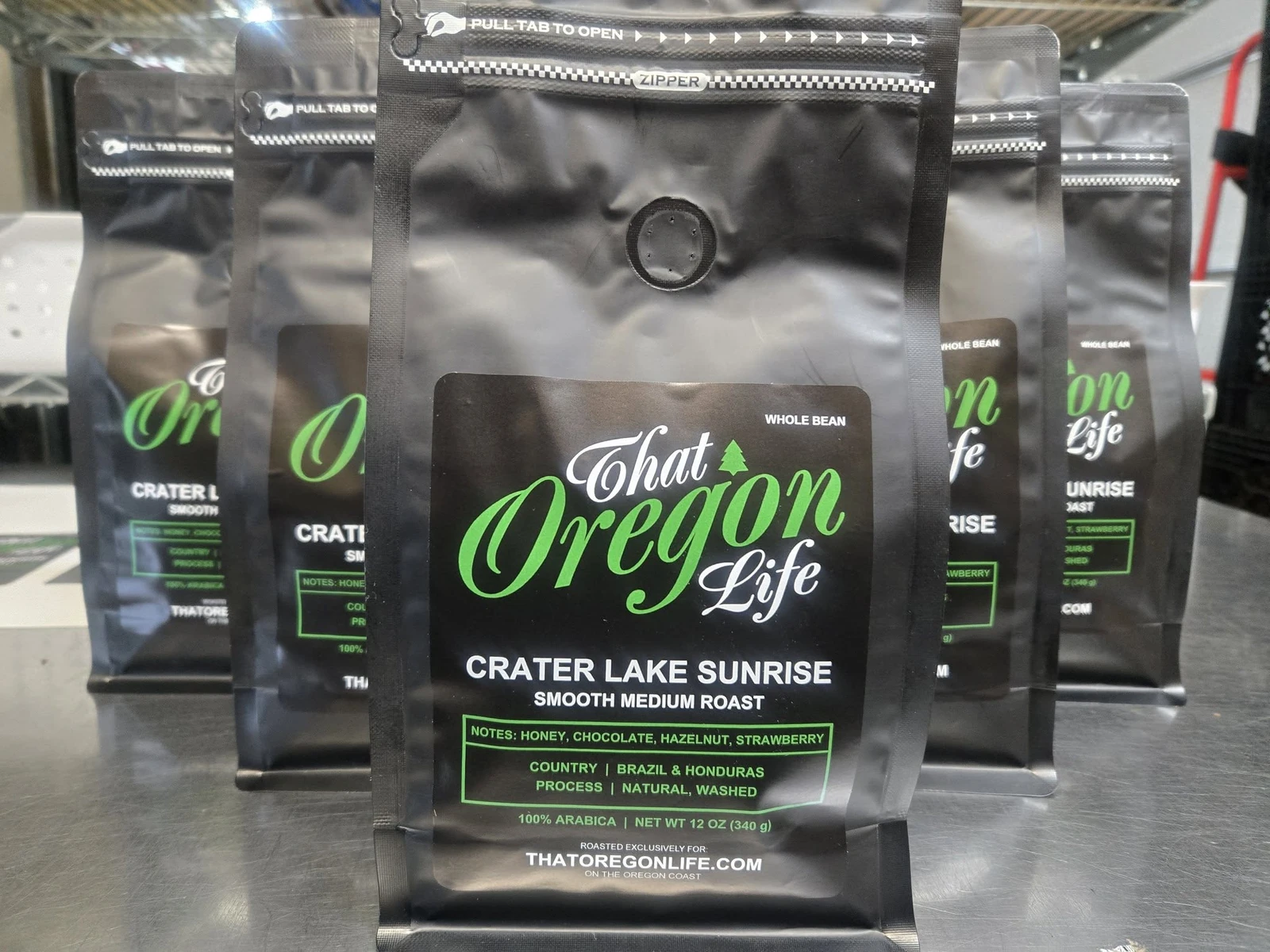 Finished bags of That Oregon Life Crater Lake Sunrise whole bean coffee