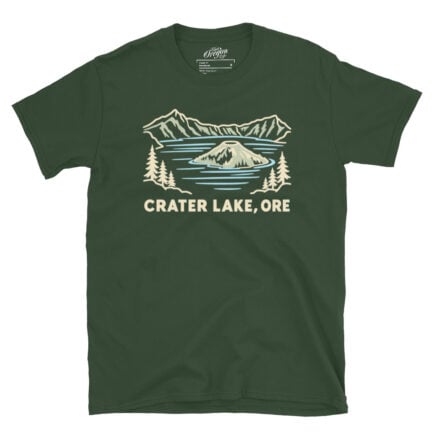 Forest Green Crater Lake Oregon tee with pale line art of Wizard Island, mountains, evergreen trees, and CRATER LAKE, ORE lettering.