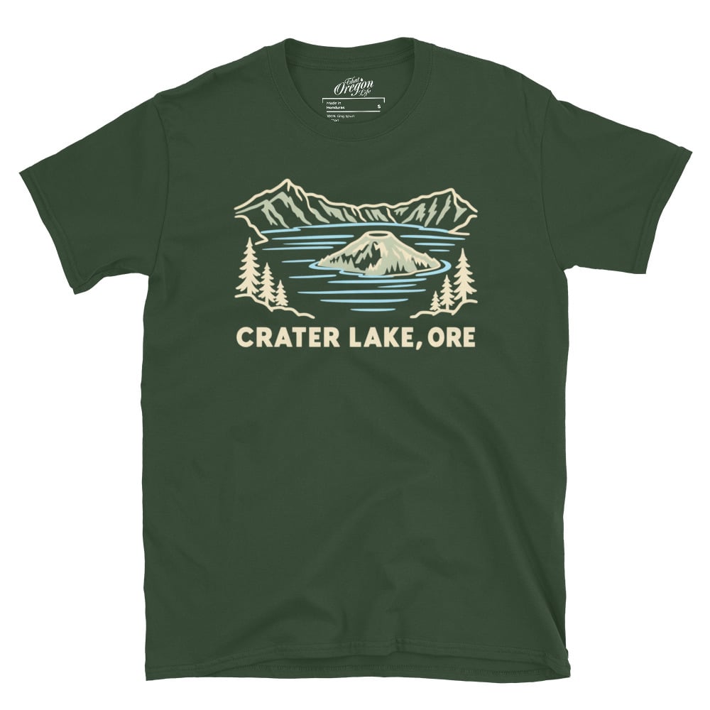 Forest Green Crater Lake Oregon tee with pale line art of Wizard Island, mountains, evergreen trees, and CRATER LAKE, ORE lettering.