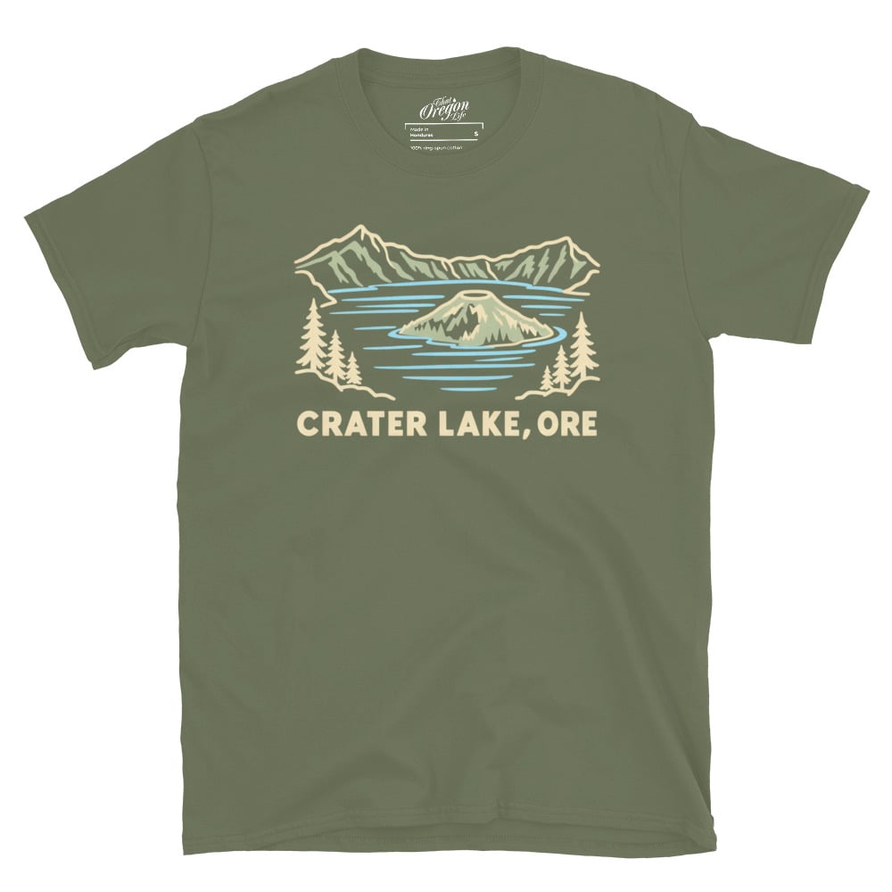 Military Green Crater Lake Oregon tee with pale line art of Wizard Island, mountains, evergreen trees, and CRATER LAKE, ORE lettering.